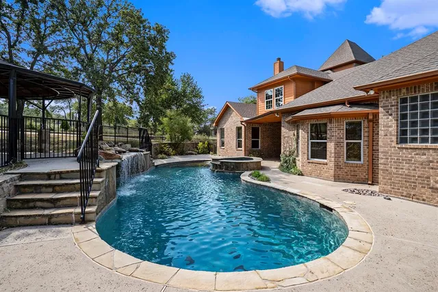 a view of a house with swimming pool