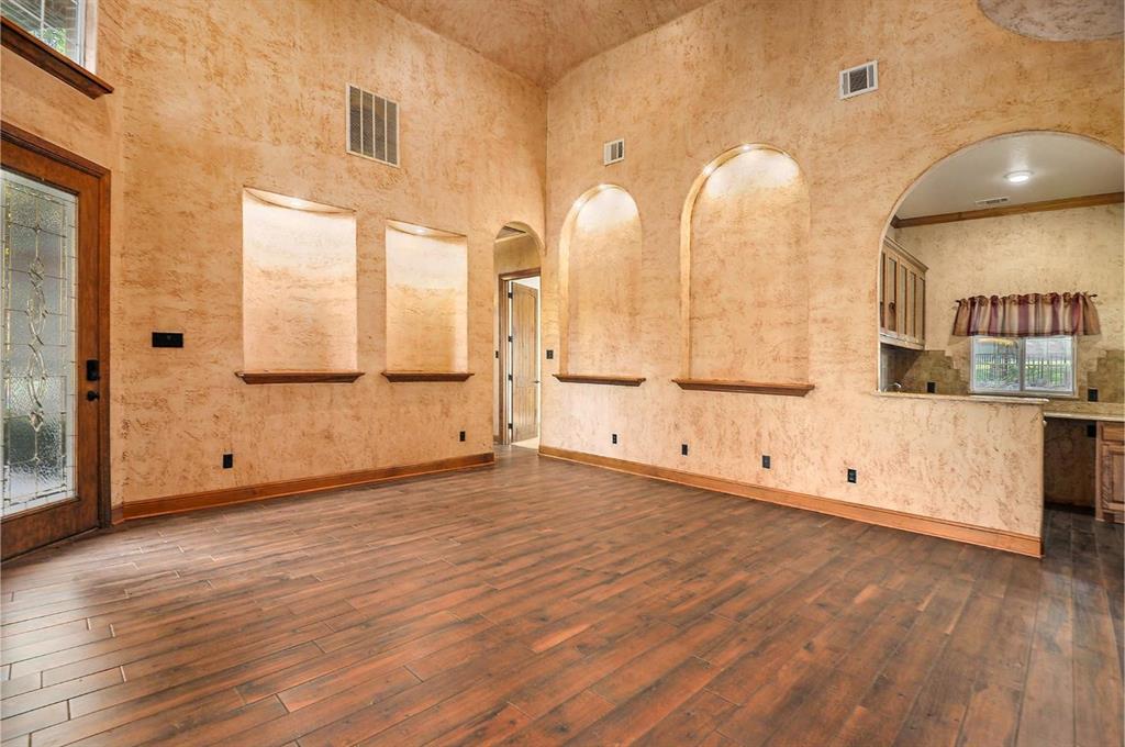 112 Bonita Drive Springtown, TX 76082 - Photo 7 of 39 a view of a kitchen with wooden floor and windows