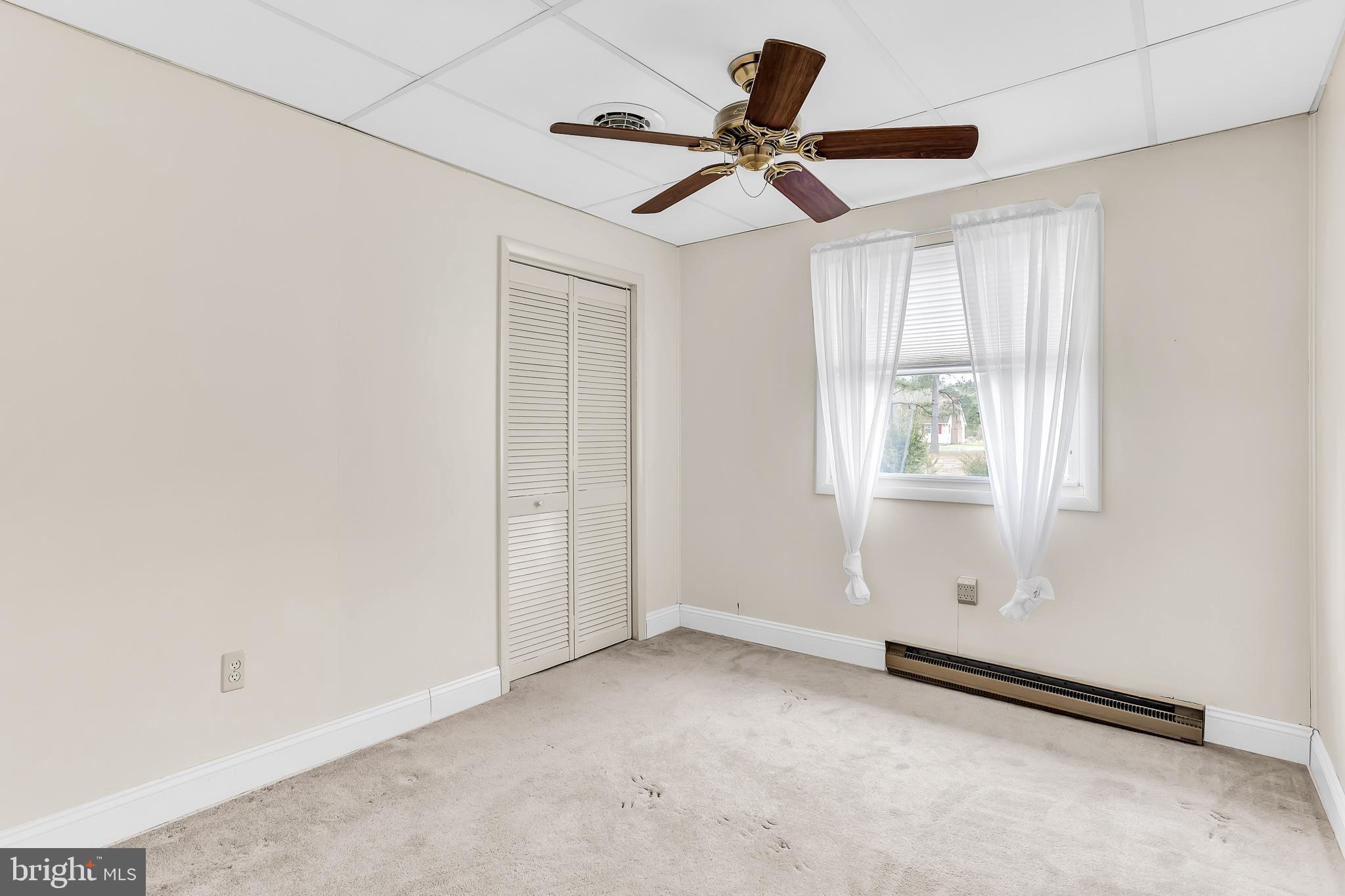 26919 Fitzgerald Road Princess Anne, MD 21853 - Photo 28 of 84 a view of a livingroom with a ceiling fan & window