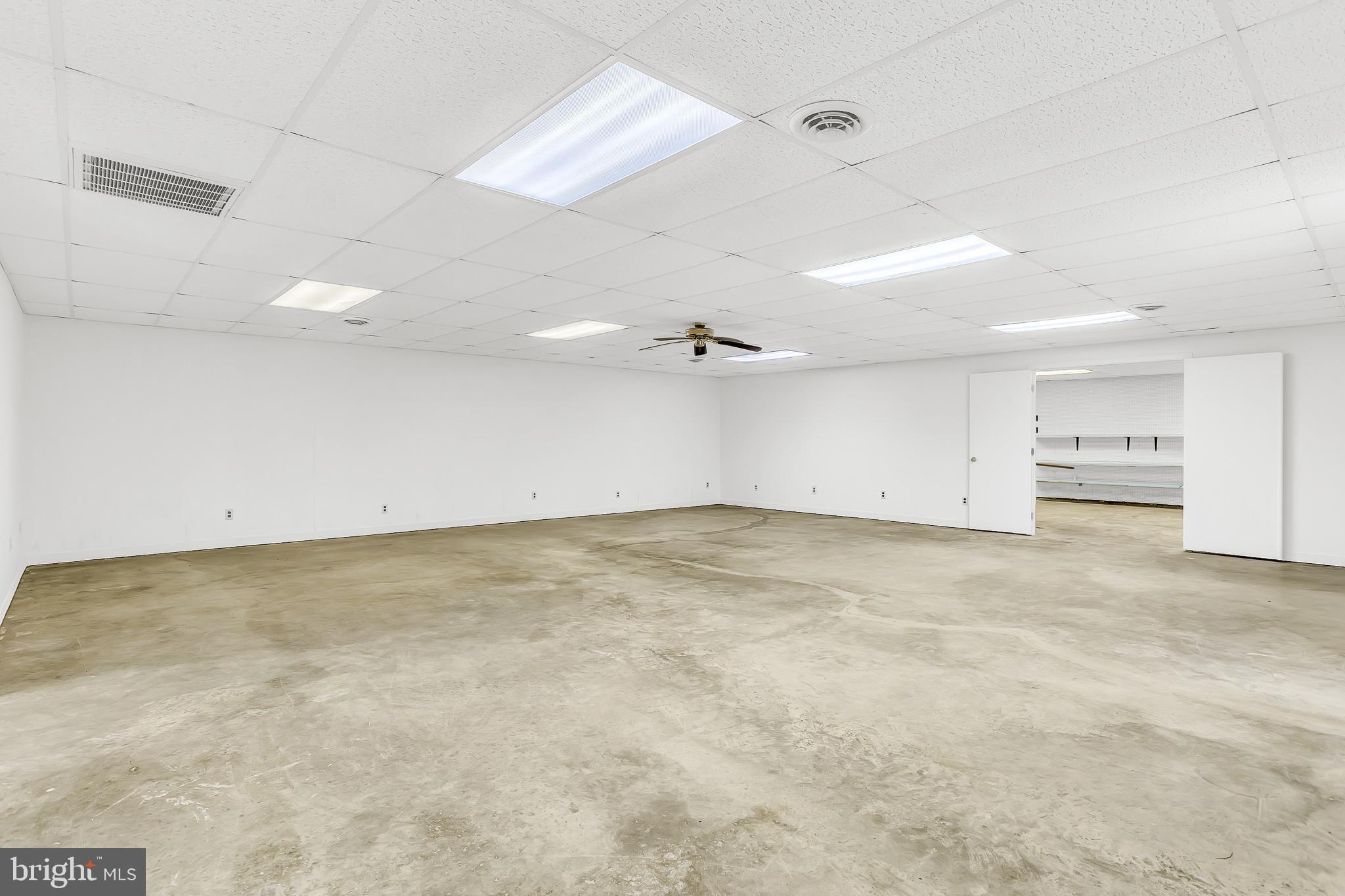 26919 Fitzgerald Road Princess Anne, MD 21853 - Photo 52 of 84 an empty room with an empty space and a ceiling fan
