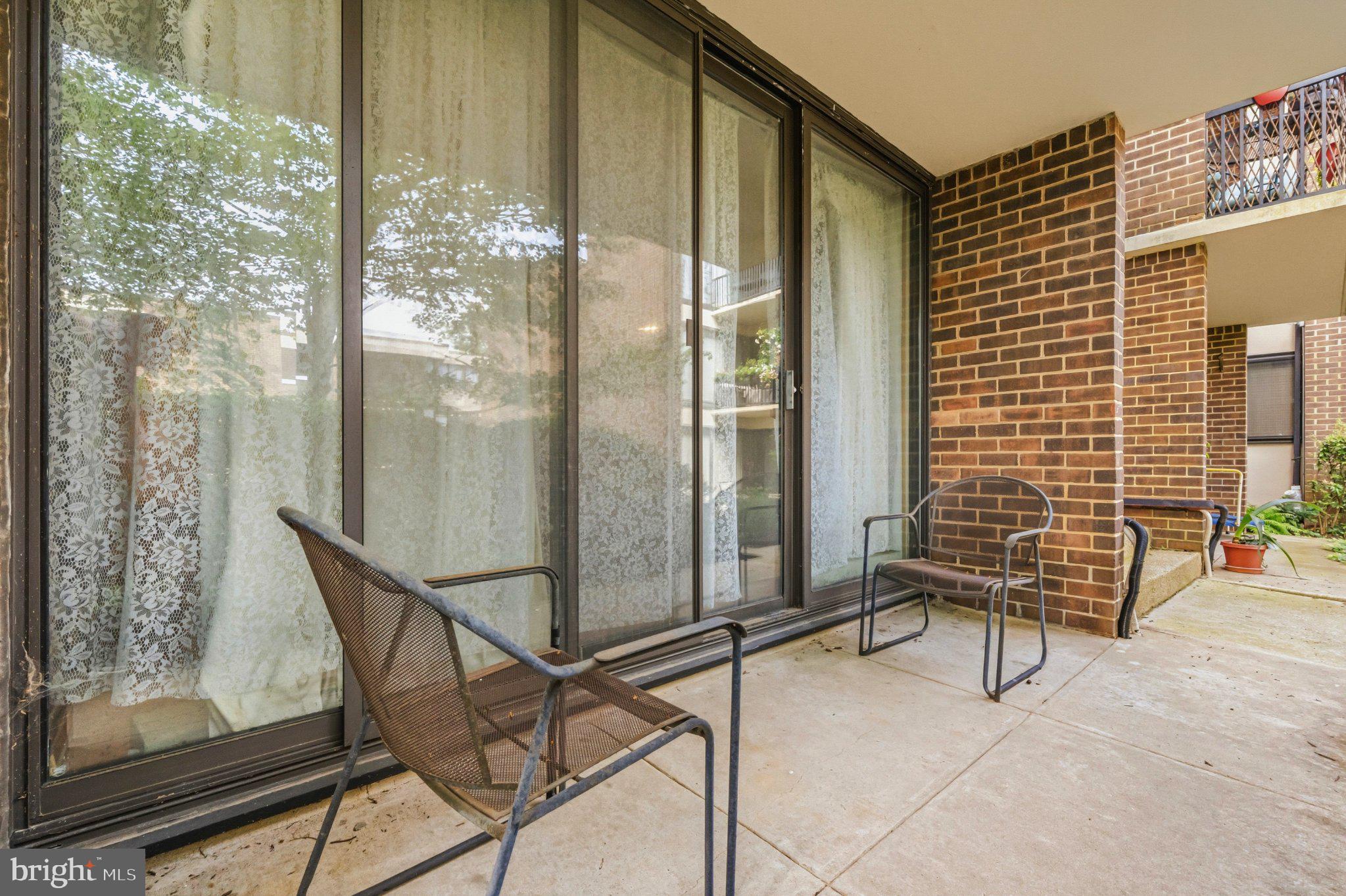 2103 Walsh View Terrace, Unit 102 Silver Spring, MD 20902 - Photo 28 of 30 Charming patio with serene views.