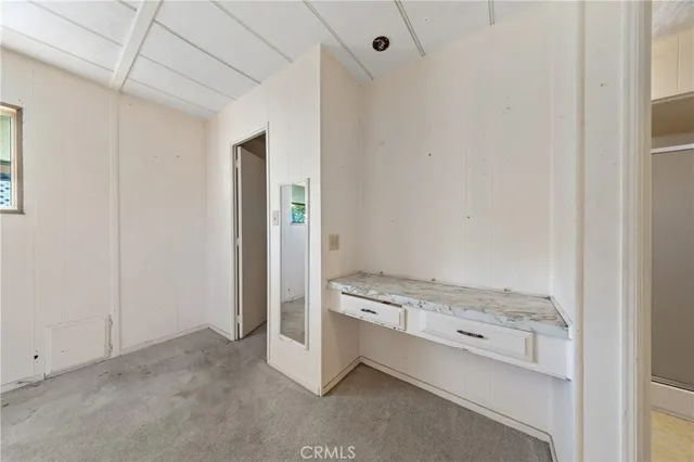 a room with a stove and a refrigerator