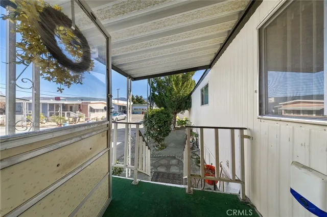 a view of a porch with seating space