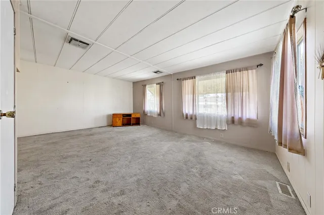 a view of empty room with windows