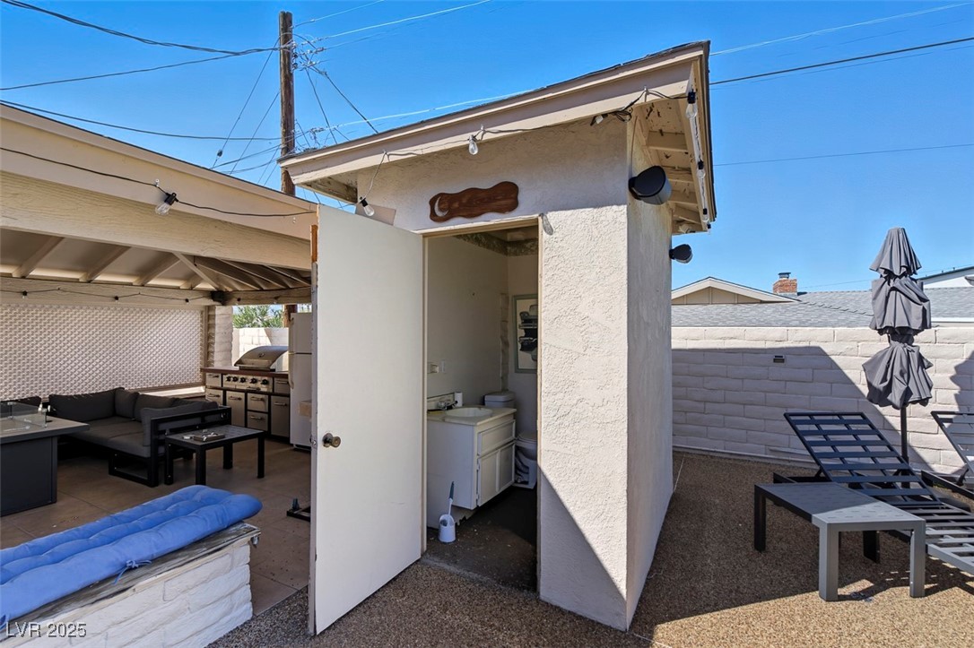 1870 East Viking Road Las Vegas, NV 89169 - Photo 36 of 44 Outdoor bathroom so pool guests don't have to bring water into the home!