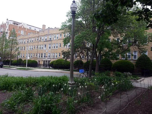 a view of a building and garden