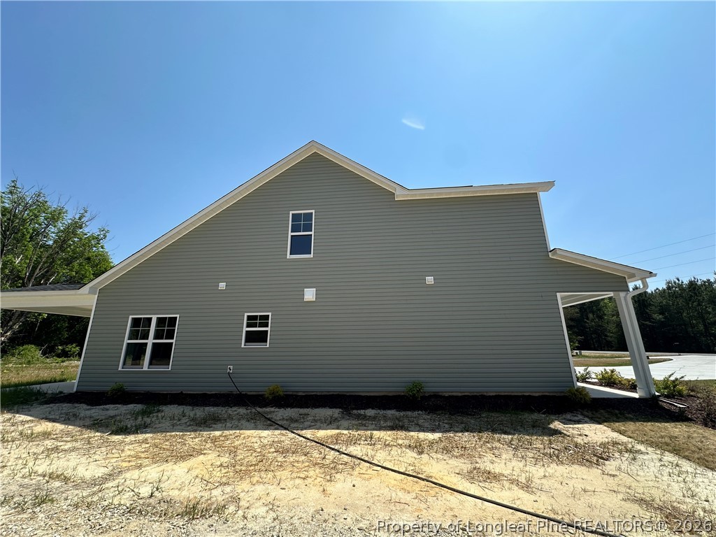 2908 Calloway Road Raeford, NC 28376 - Photo 25 of 25 a view of a house with a yard