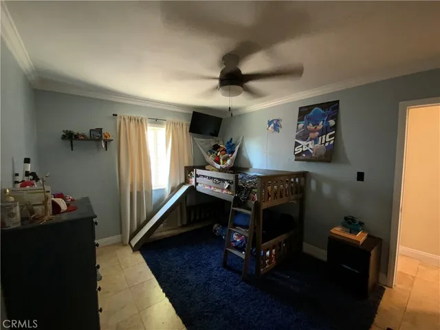 a bedroom with furniture and a wooden floor