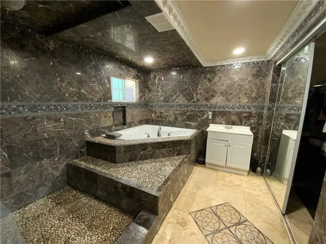 a bathroom with a sink toilet and mirror