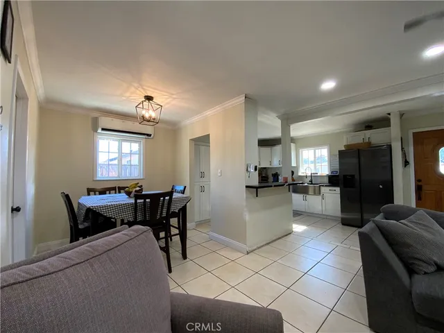 a view of kitchen with dining table and chairs