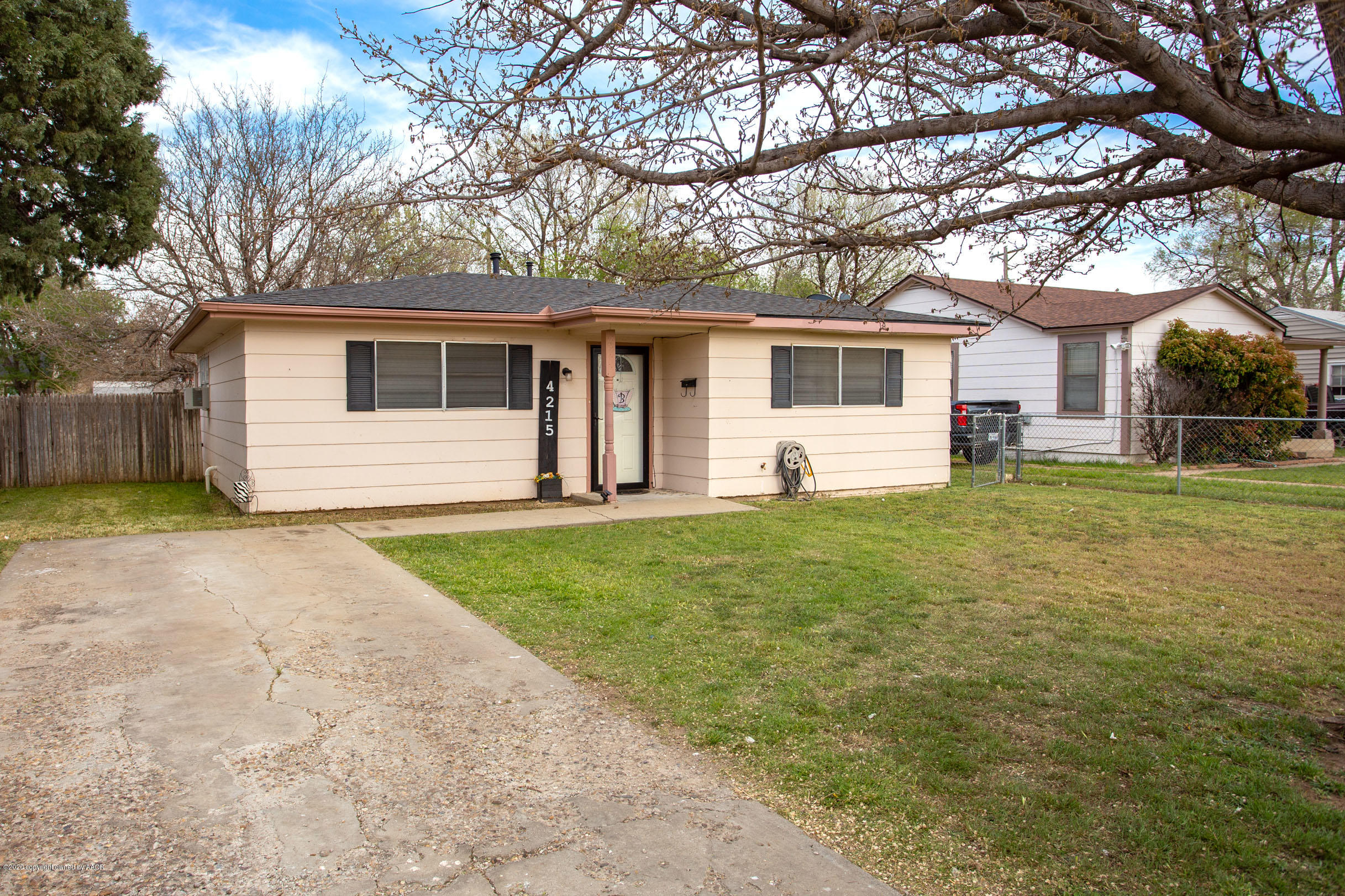 4215 South Monroe Street Amarillo, TX 79110 - Photo 1 of 27 a front view of house with yard and trees