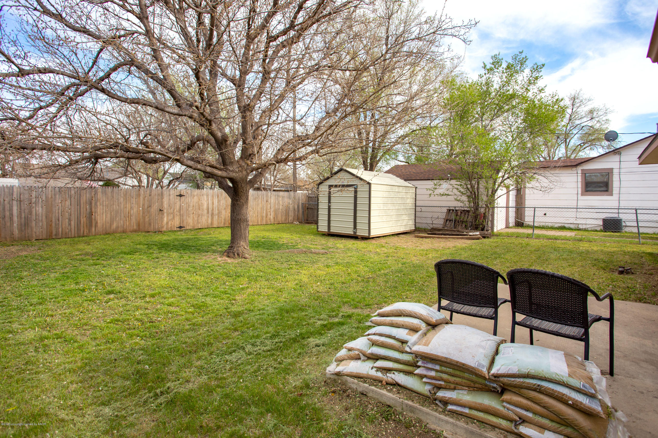 4215 South Monroe Street Amarillo, TX 79110 - Photo 24 of 27 a backyard of a house with table and chairs