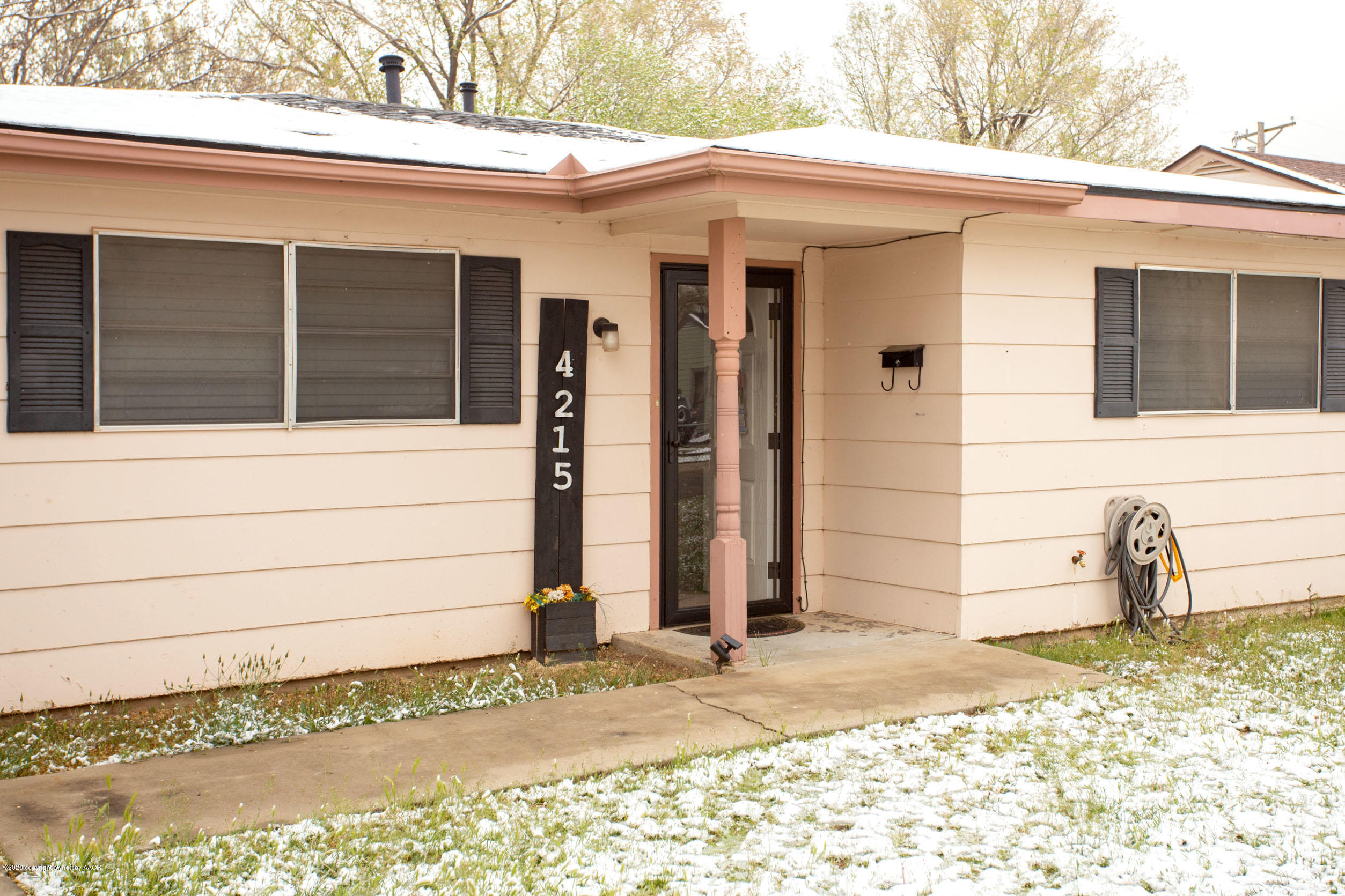 4215 South Monroe Street Amarillo, TX 79110 - Photo 6 of 27 a side view of a house with a patio