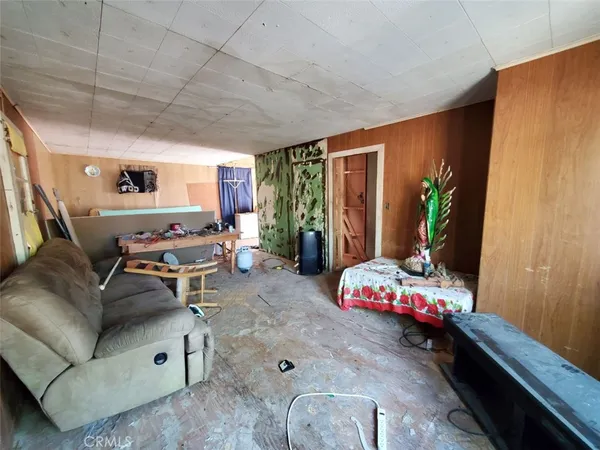 a living room with furniture and flat screen tv