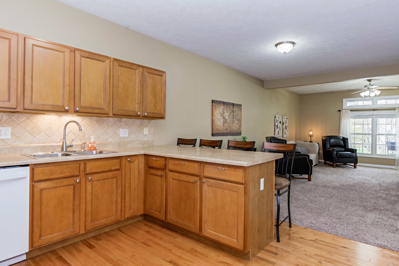 1611 Belclare Road Normal, IL 61761 - Photo 11 of 34 a kitchen with a sink cabinets and wooden floor