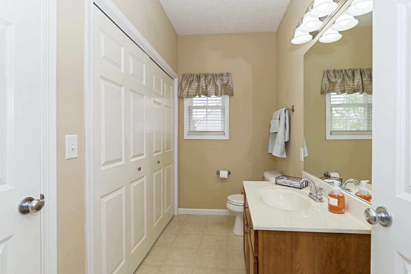 1611 Belclare Road Normal, IL 61761 - Photo 13 of 34 a bathroom with a sink a mirror and a shower