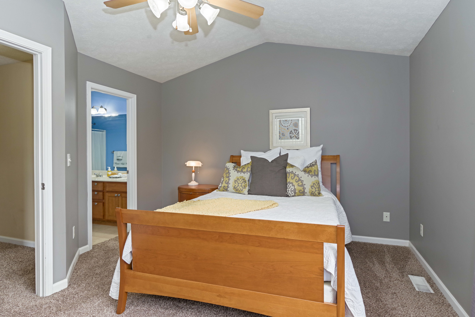 1611 Belclare Road Normal, IL 61761 - Photo 14 of 34 a bedroom with a bed and a chandelier