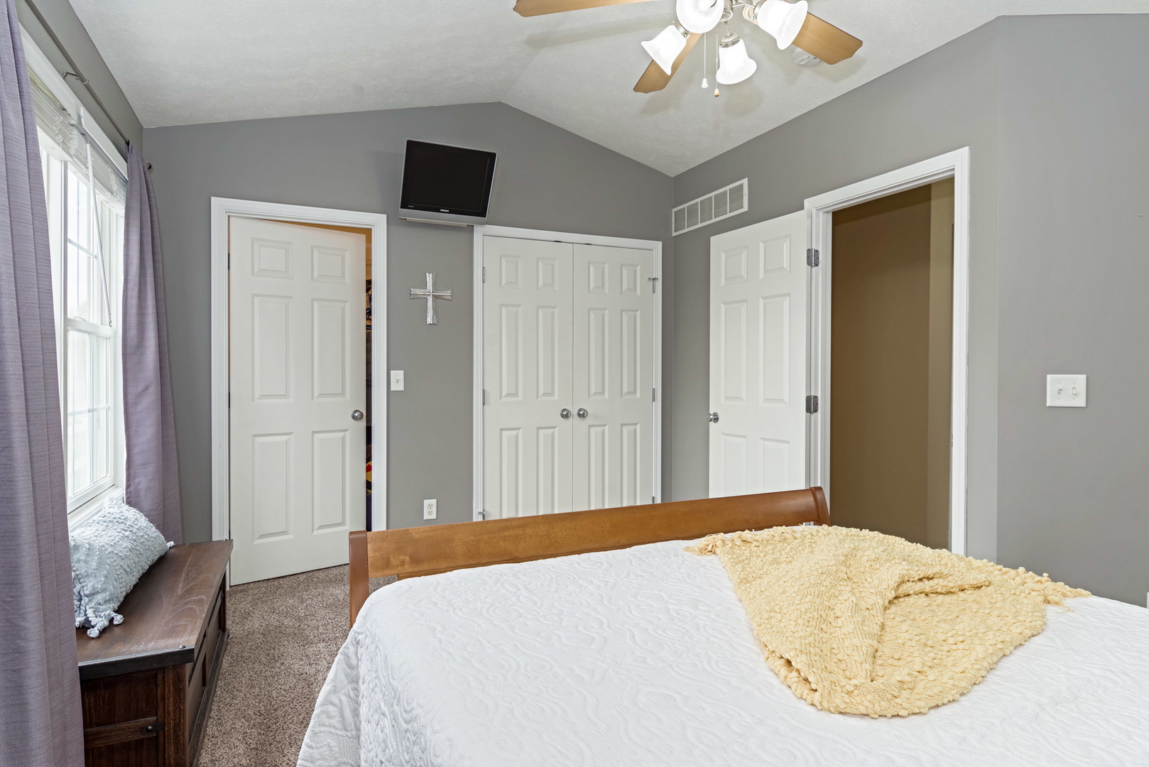 1611 Belclare Road Normal, IL 61761 - Photo 15 of 34 a bedroom with a bed and a chandelier