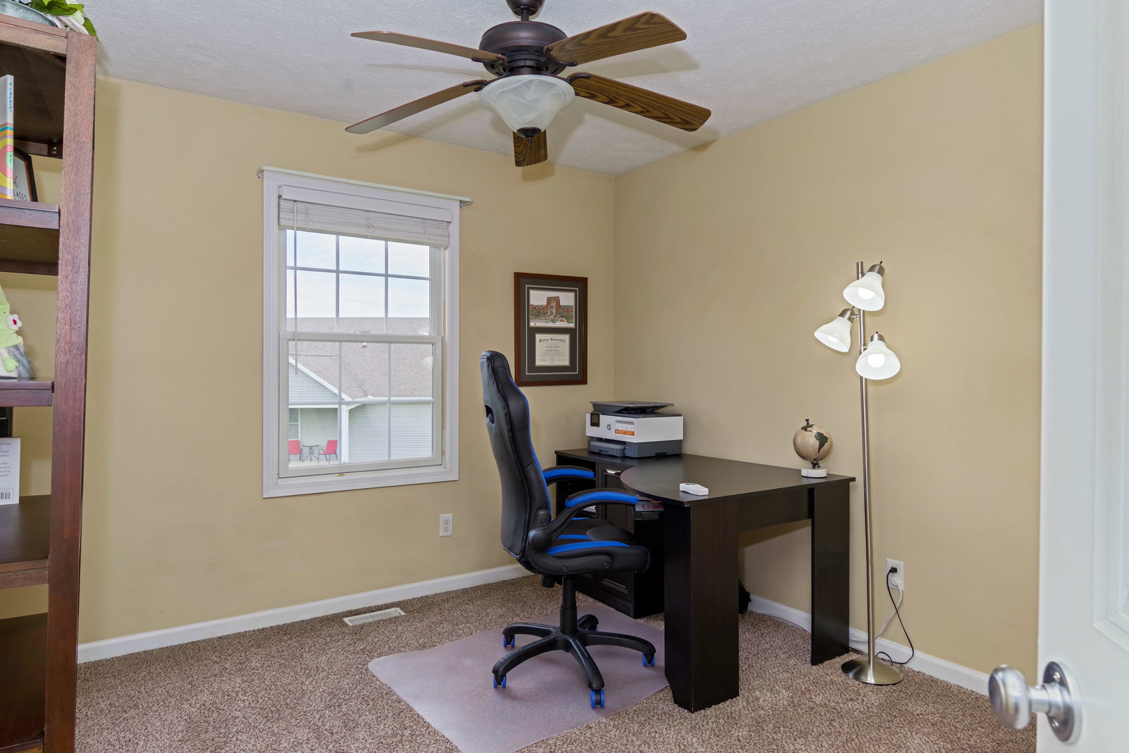 1611 Belclare Road Normal, IL 61761 - Photo 18 of 34 a view of a workspace with furniture and a window
