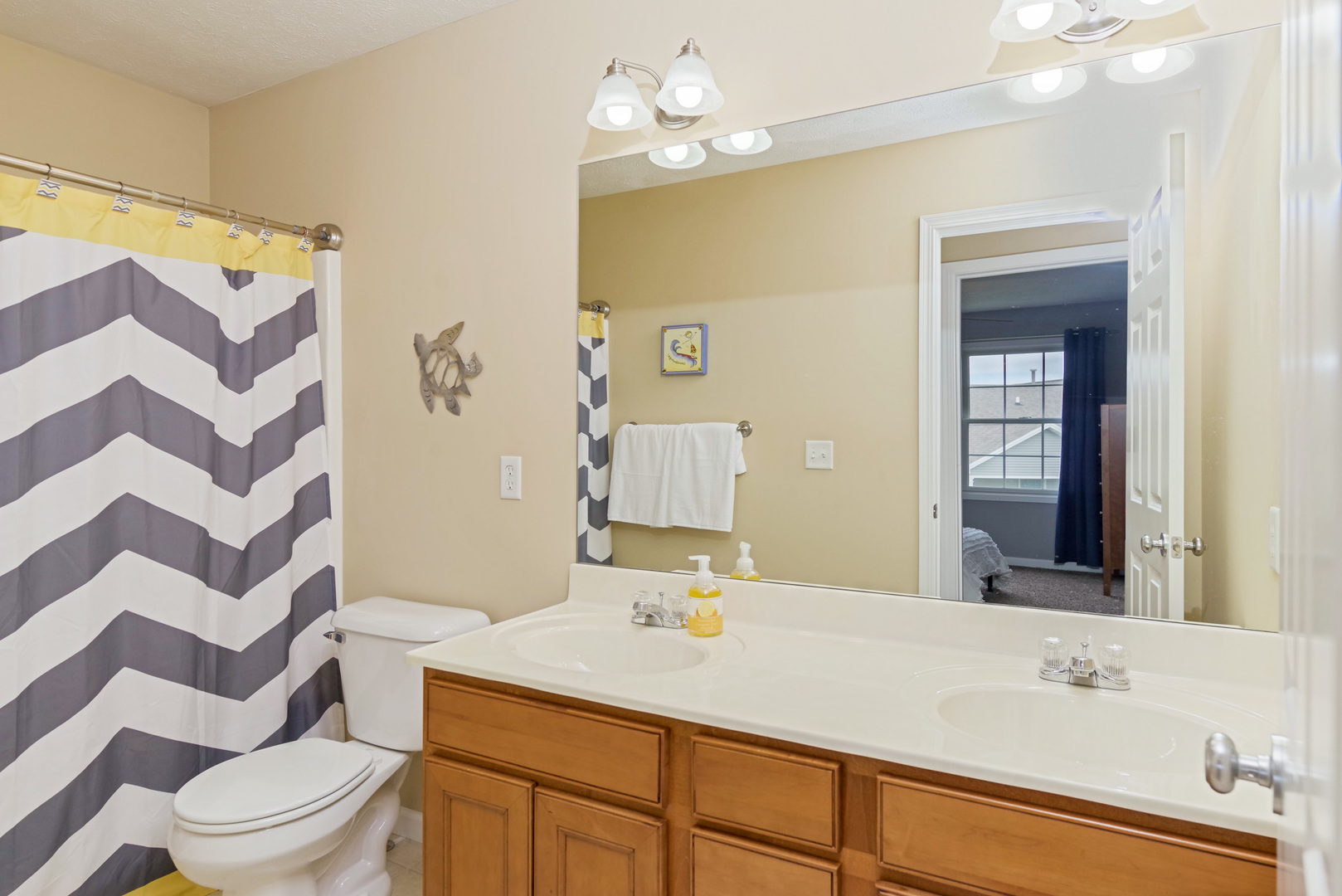 1611 Belclare Road Normal, IL 61761 - Photo 20 of 34 a bathroom with a sink a toilet and shower