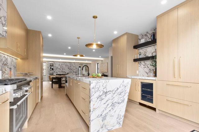a view of a living room and kitchen