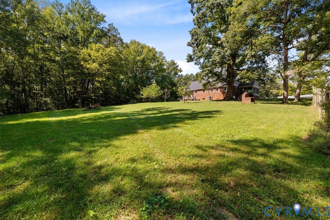 3577 Old Buckingham Road Powhatan, VA 23139 - Photo 9 of 36 Expansive grassy yard with mature trees and a part