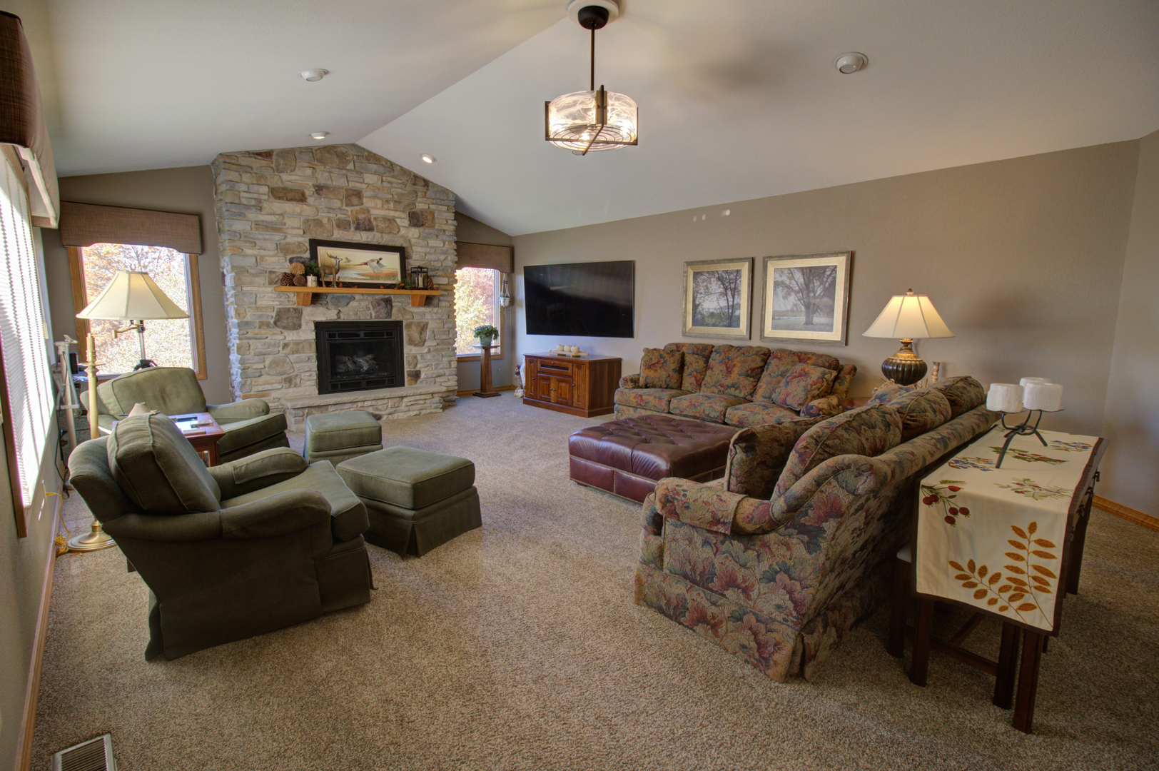 16360 Spring Valley Road Morrison, IL 61270 - Photo 15 of 60 a living room with furniture a flat screen tv and a fireplace