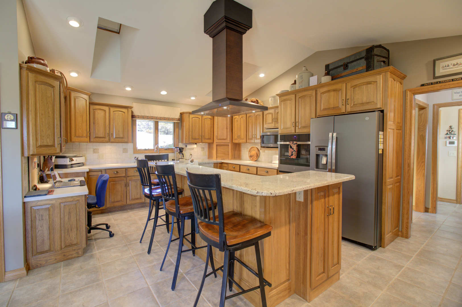 16360 Spring Valley Road Morrison, IL 61270 - Photo 21 of 60 a kitchen with refrigerator a table and chairs