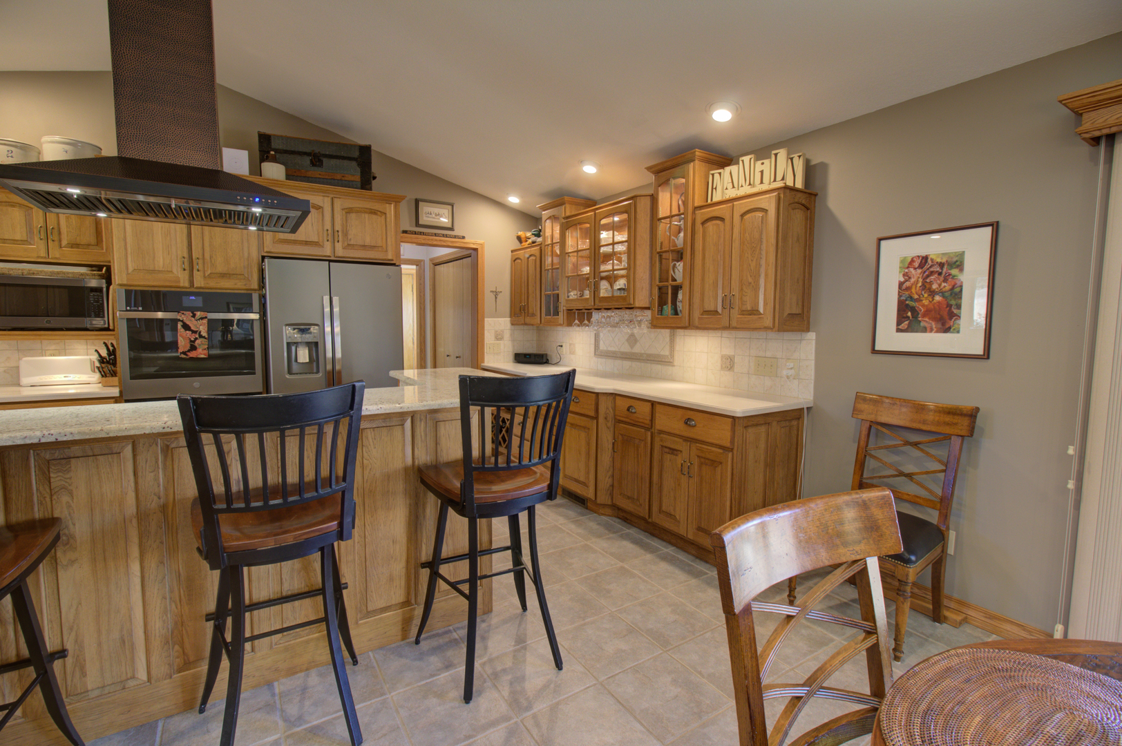 16360 Spring Valley Road Morrison, IL 61270 - Photo 22 of 60 a kitchen with a dining table and chairs