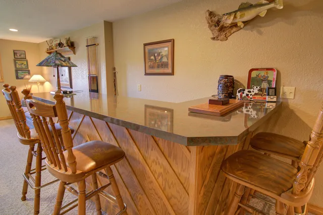 a living room with furniture and fireplace