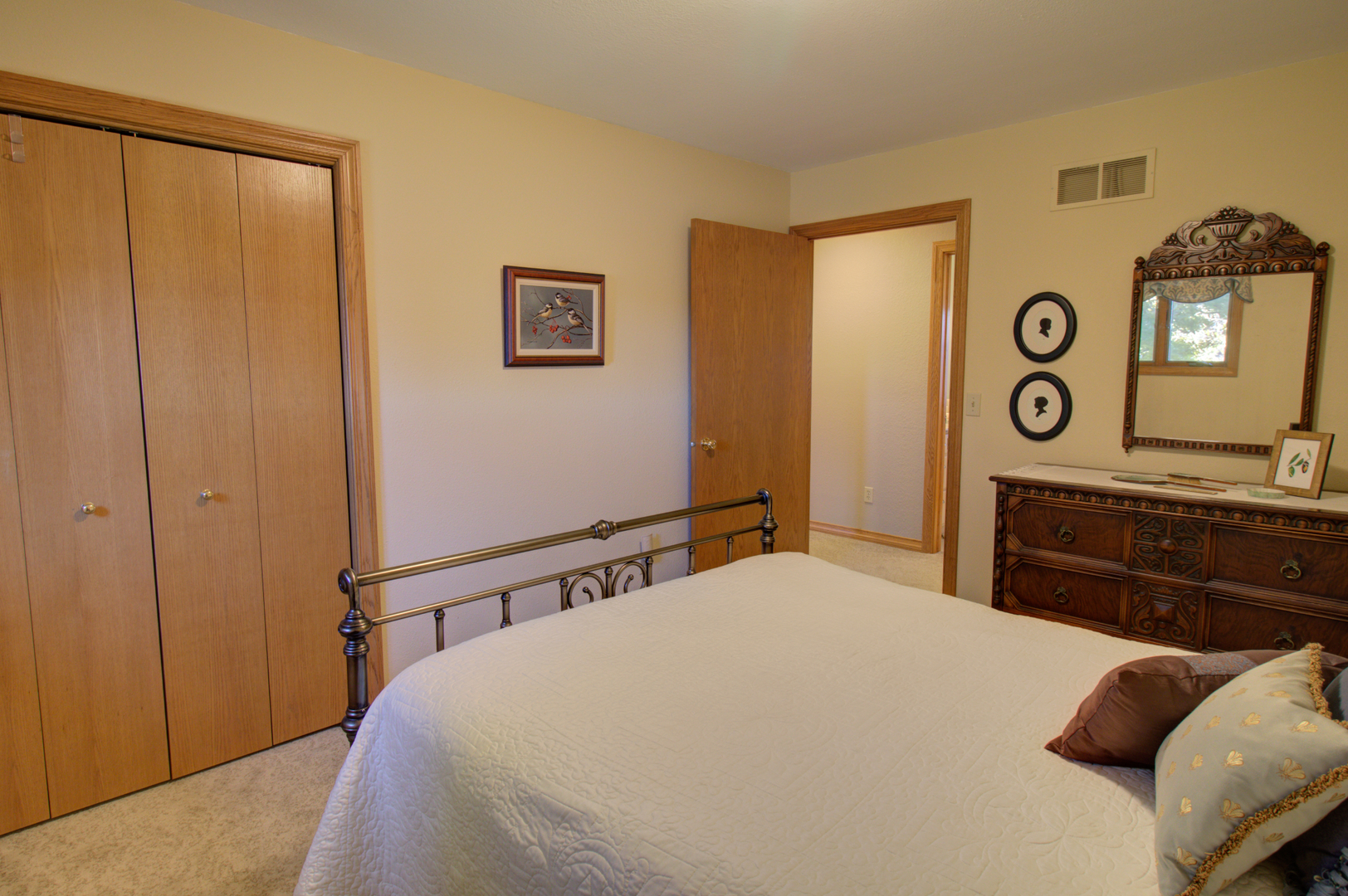 16360 Spring Valley Road Morrison, IL 61270 - Photo 35 of 60 a bedroom with a bed and cabinets