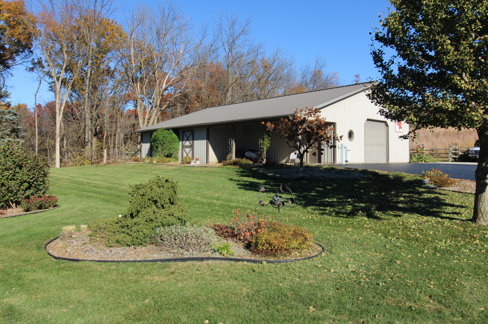 16360 Spring Valley Road Morrison, IL 61270 - Photo 9 of 60 a view of a house with backyard and trees