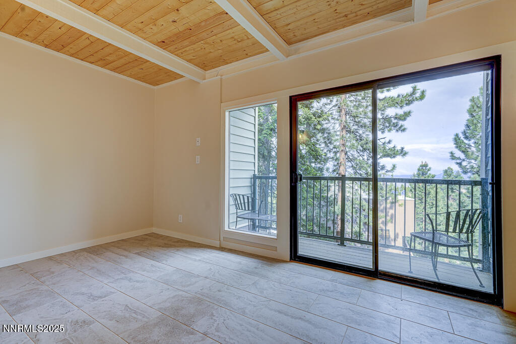 331 Tramway Drive, Unit 17 Stateline, NV 89449 - Photo 11 of 22 an empty room with wooden floor and doors
