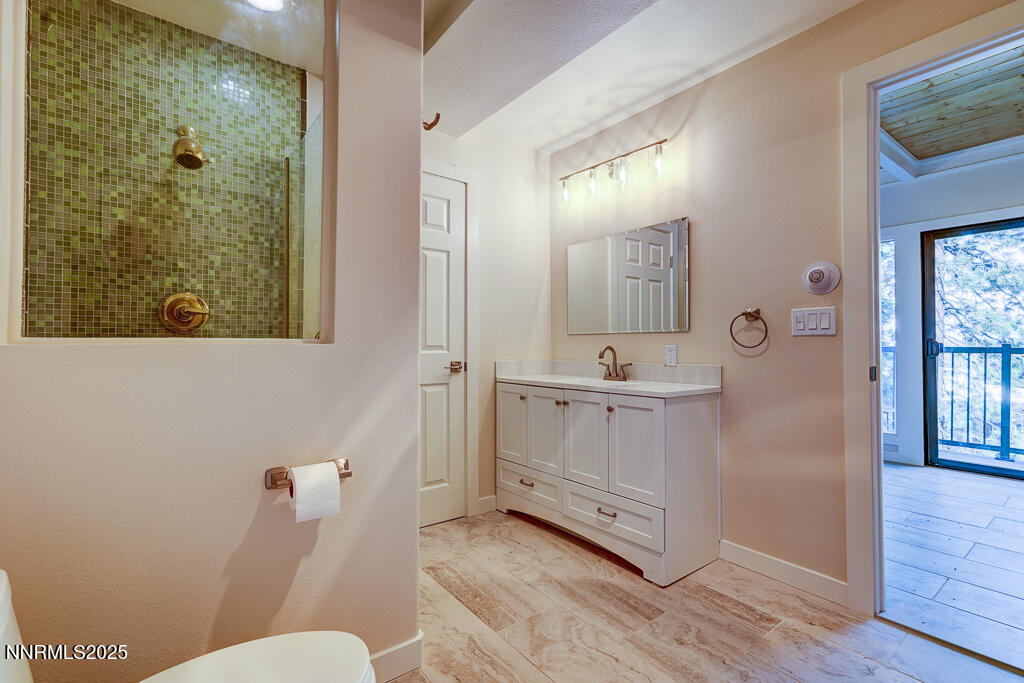 331 Tramway Drive, Unit 17 Stateline, NV 89449 - Photo 14 of 22 a bathroom with a sink a toilet and shower