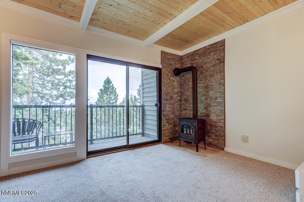 331 Tramway Drive, Unit 17 Stateline, NV 89449 - Photo 4 of 22 a view of an empty room with furniture and a large window