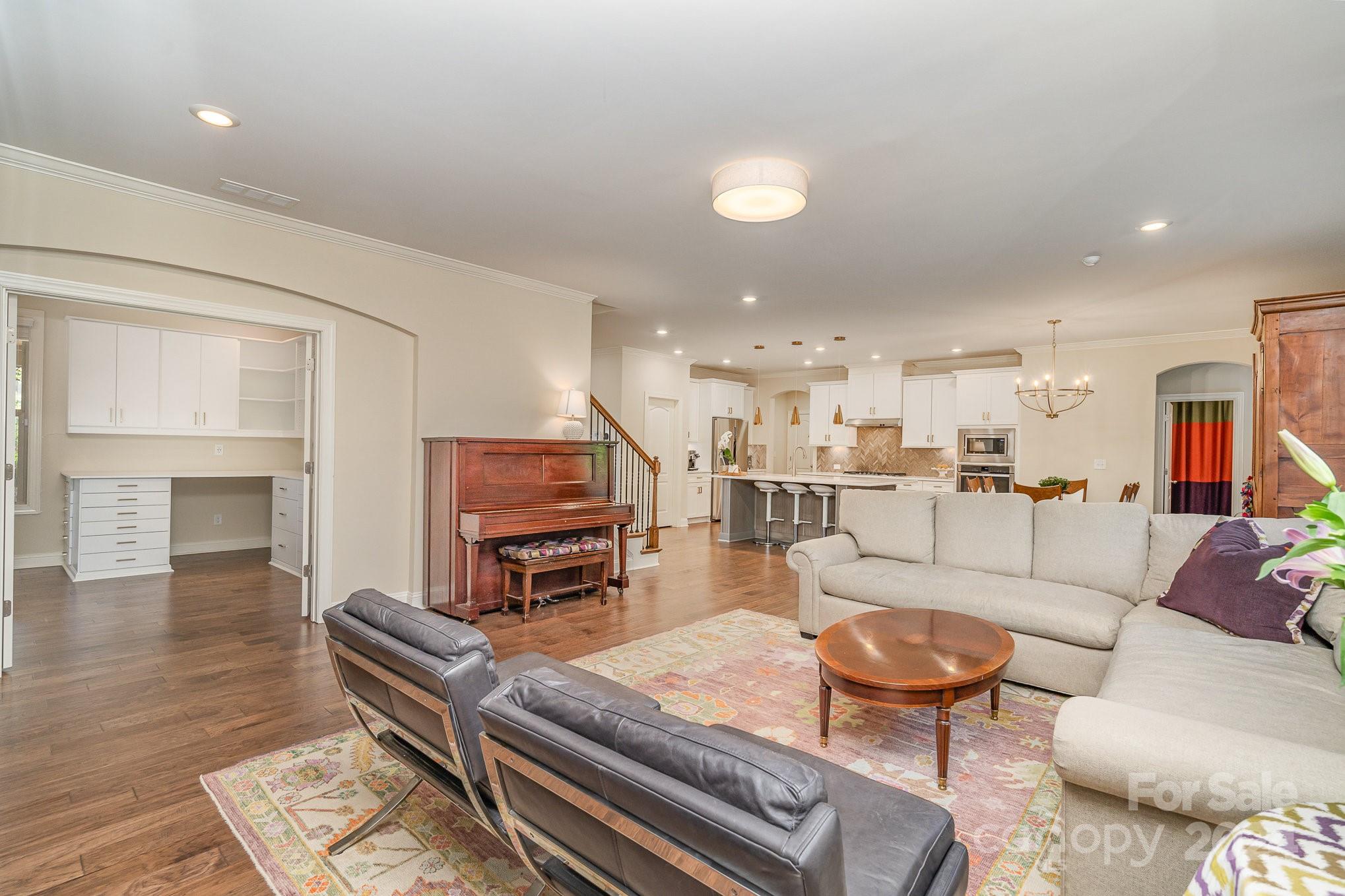104 Smithfield Drive Charlotte, NC 28270 - Photo 11 of 39 a living room with furniture and a wooden floor