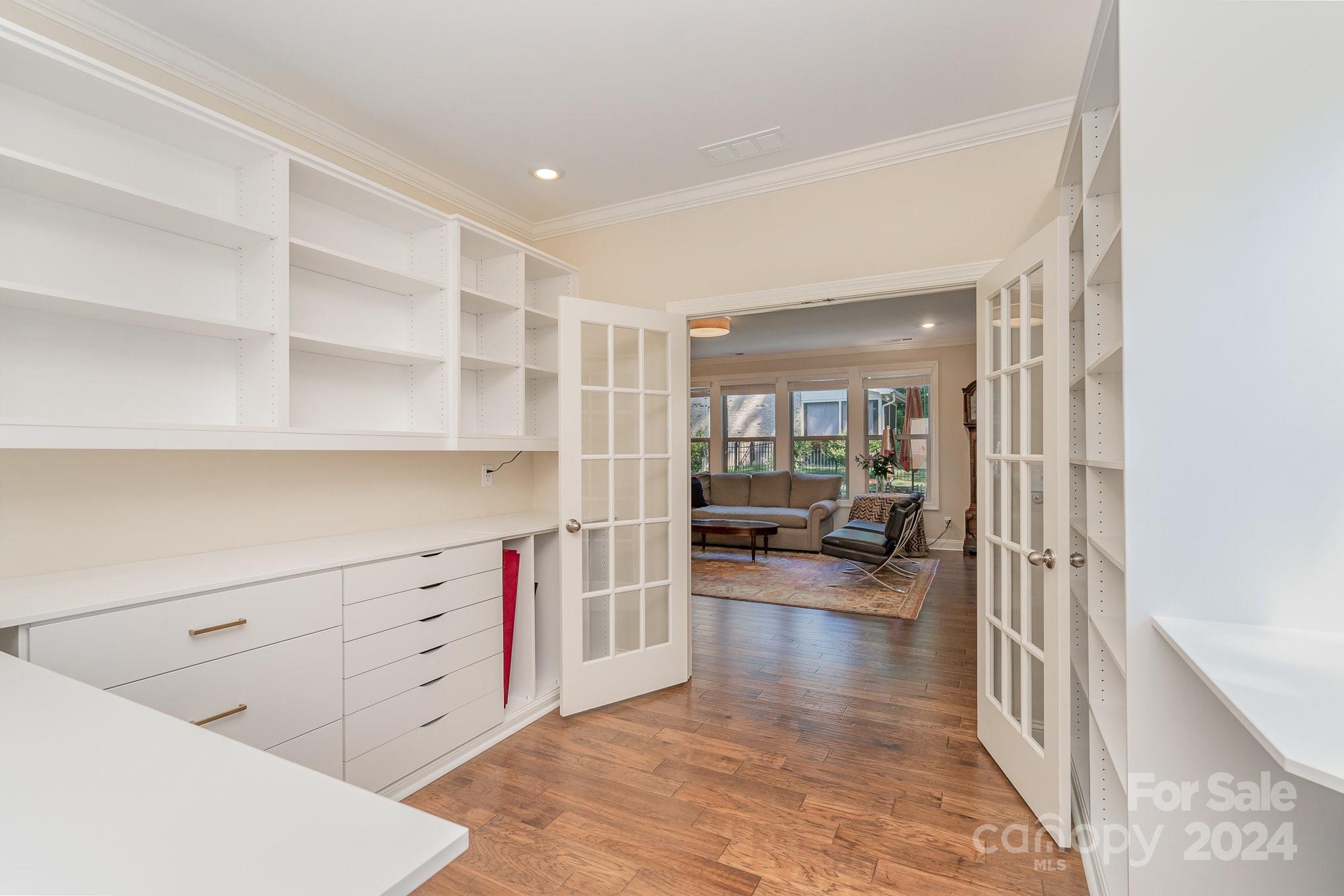 104 Smithfield Drive Charlotte, NC 28270 - Photo 13 of 39 a living room with furniture and a wooden floor