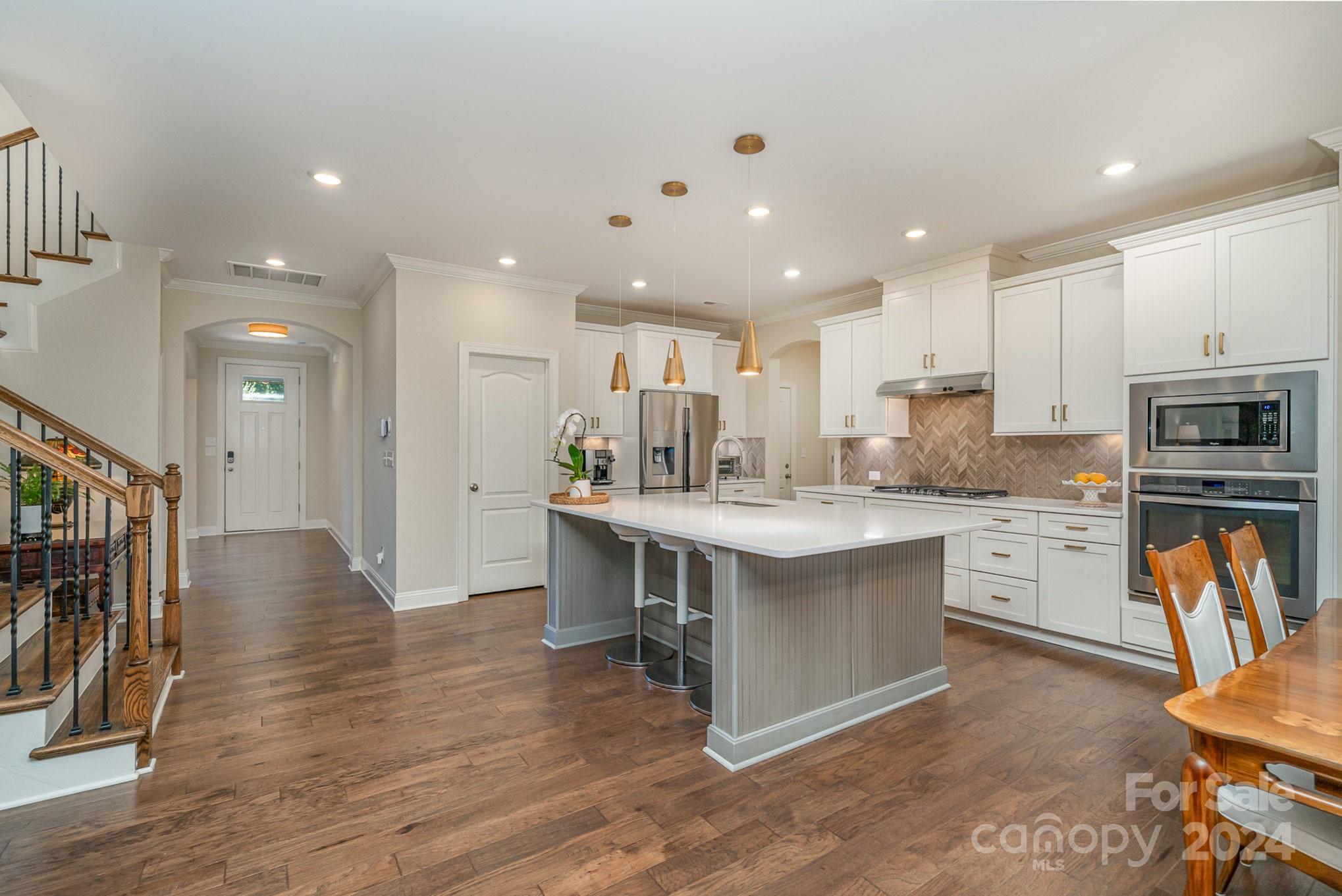 104 Smithfield Drive Charlotte, NC 28270 - Photo 16 of 39 a kitchen with stainless steel appliances granite countertop a refrigerator and a stove top oven