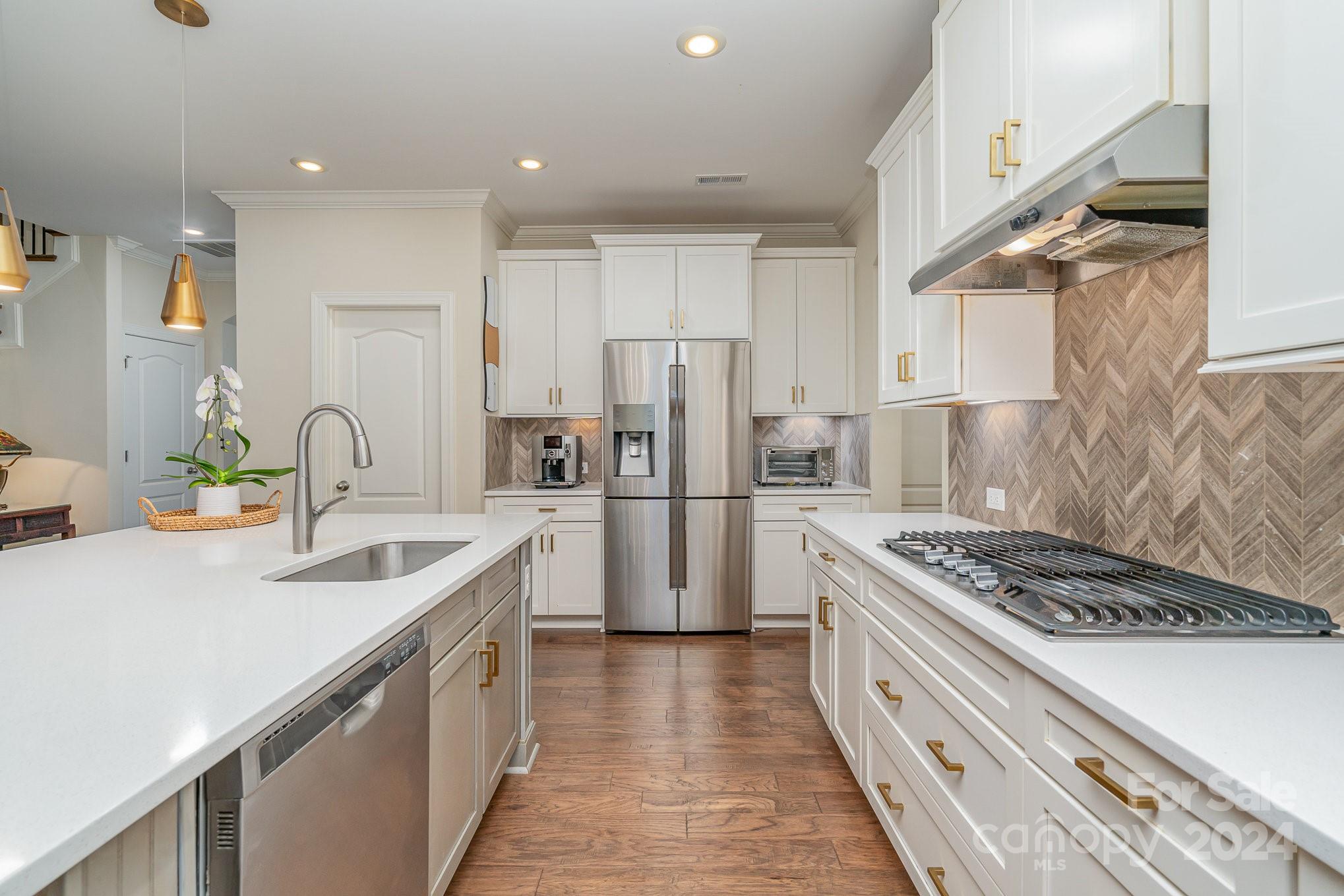 104 Smithfield Drive Charlotte, NC 28270 - Photo 17 of 39 a kitchen with refrigerator a stove and a sink