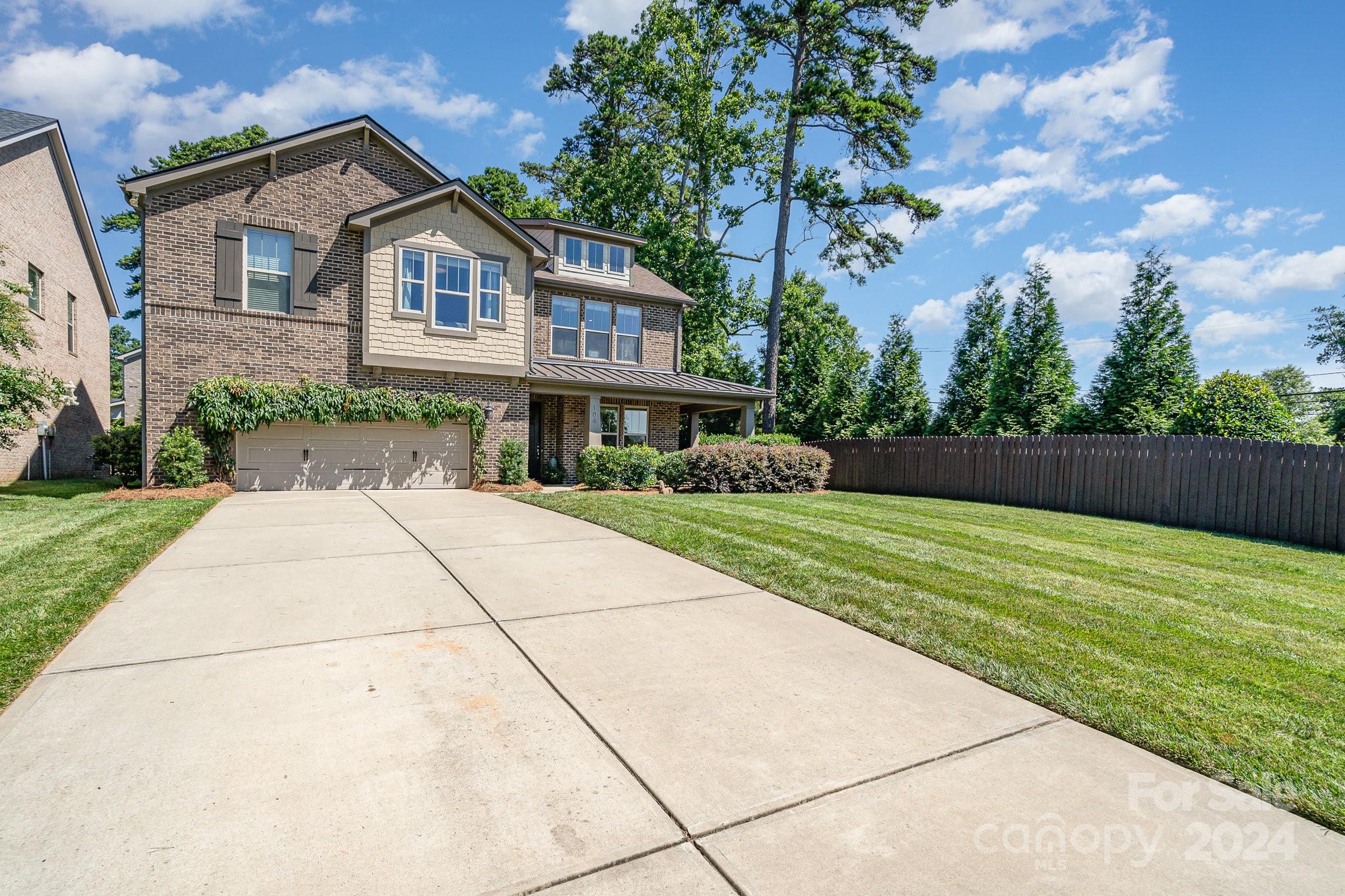 104 Smithfield Drive Charlotte, NC 28270 - Photo 2 of 39 a front view of house with yard and green space