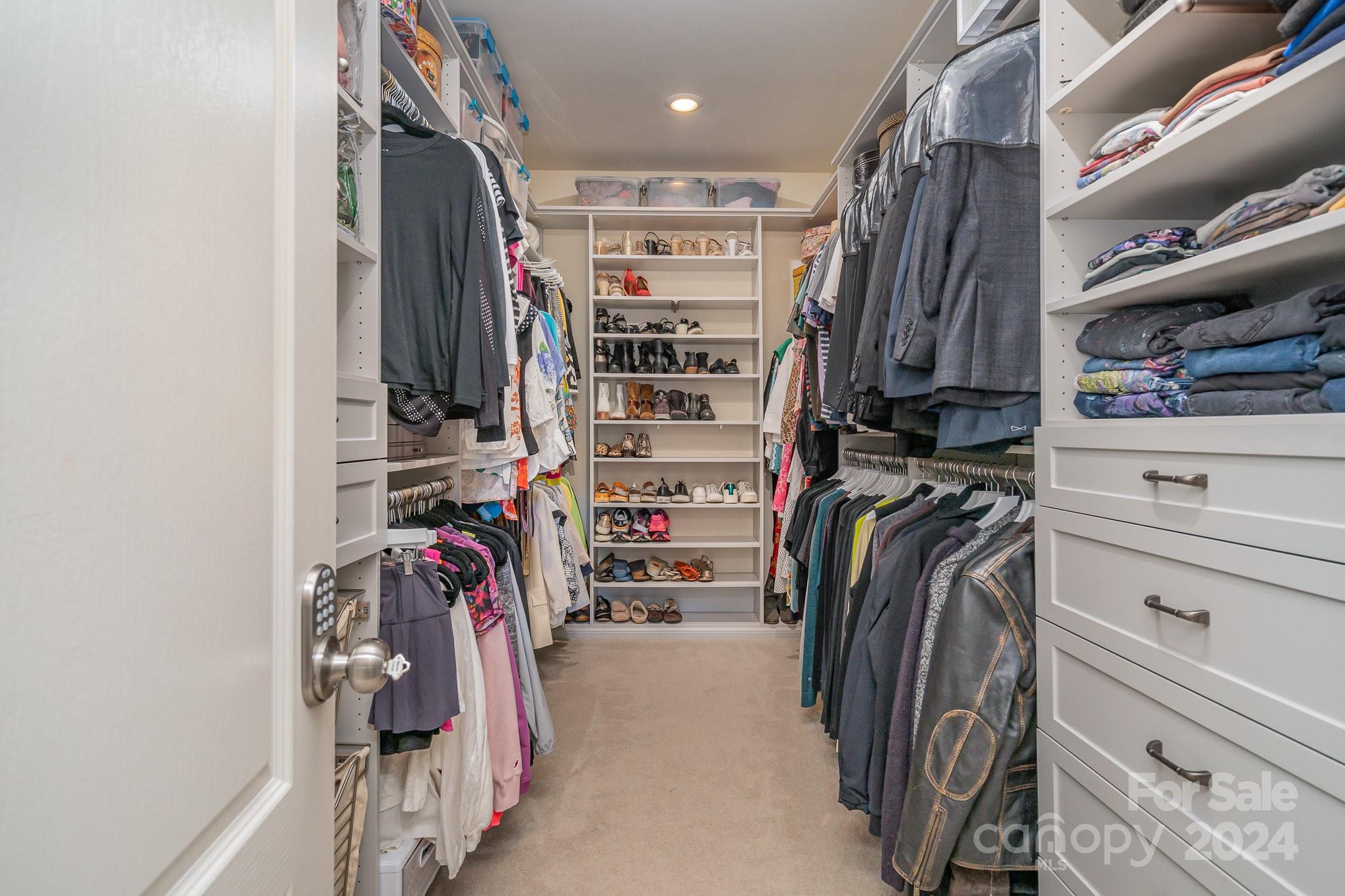 104 Smithfield Drive Charlotte, NC 28270 - Photo 25 of 39 a view of walk in closet with clothes and shoes