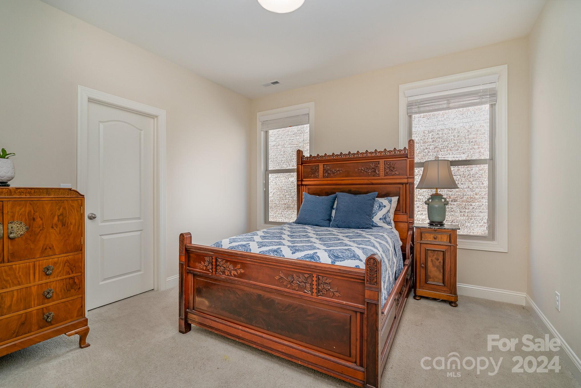 104 Smithfield Drive Charlotte, NC 28270 - Photo 30 of 39 a room with a bed and a dresser