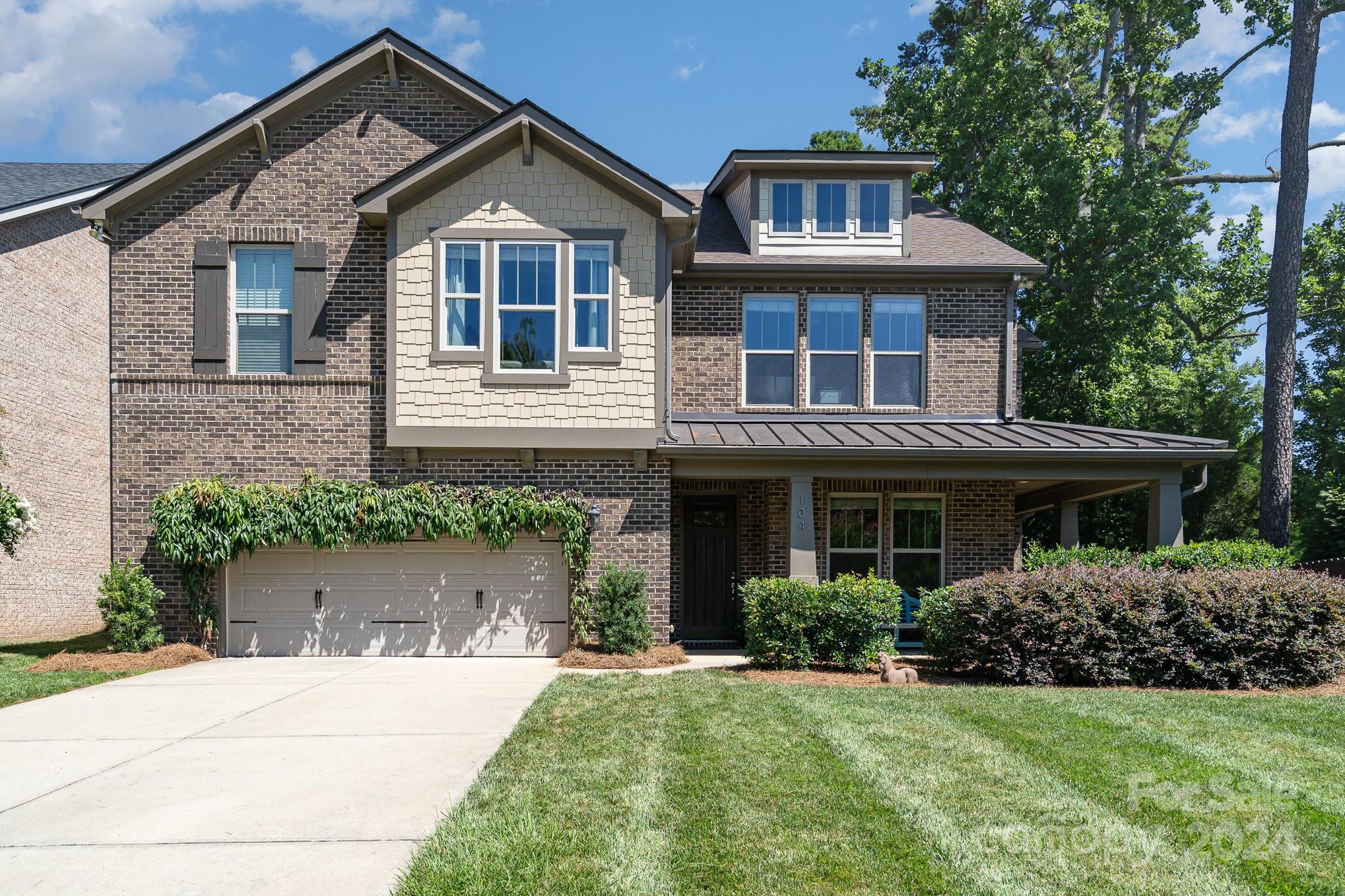 104 Smithfield Drive Charlotte, NC 28270 - Photo 3 of 39 a front view of a house with a yard