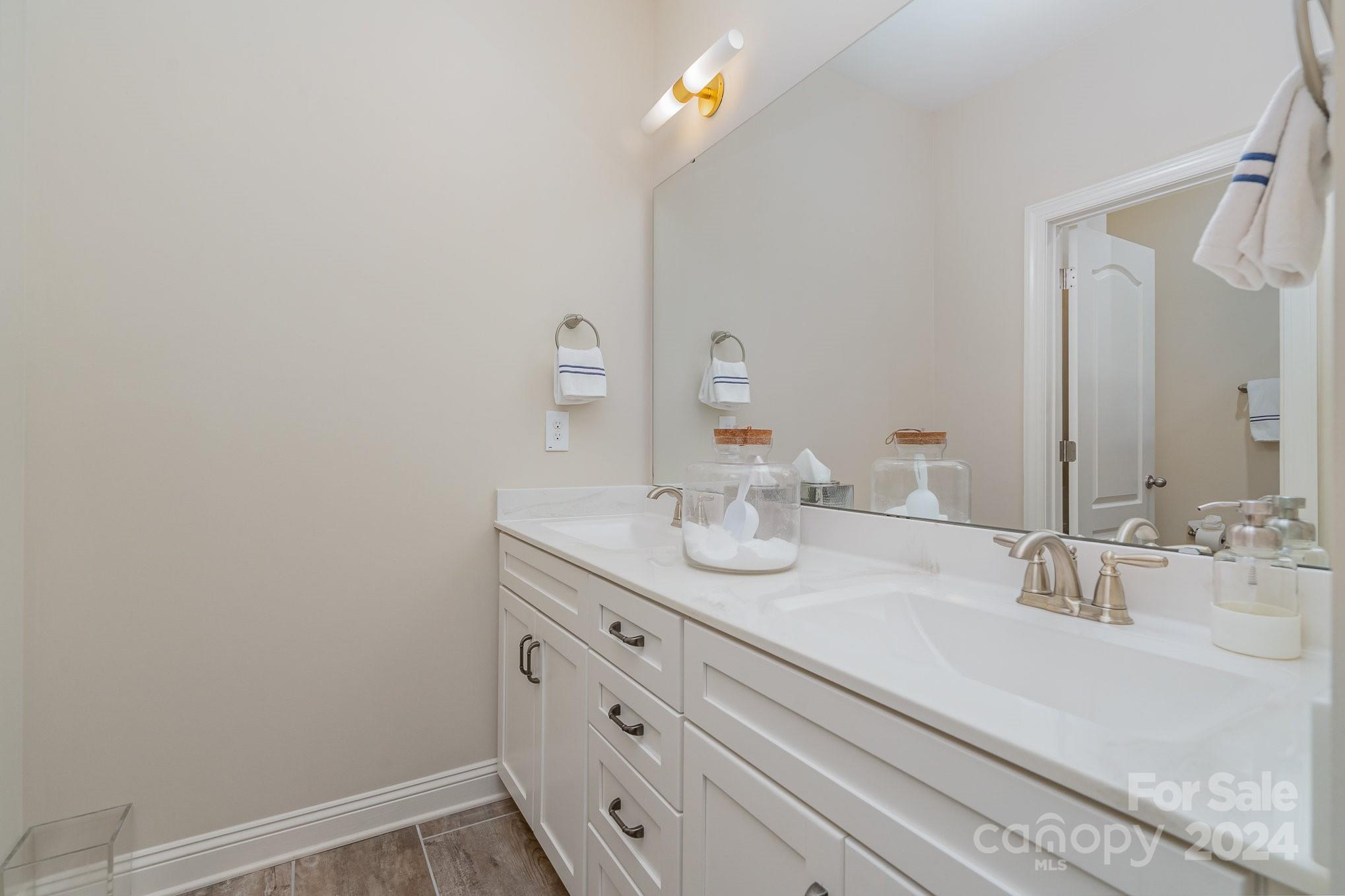 104 Smithfield Drive Charlotte, NC 28270 - Photo 31 of 39 a bathroom with a sink and a mirror