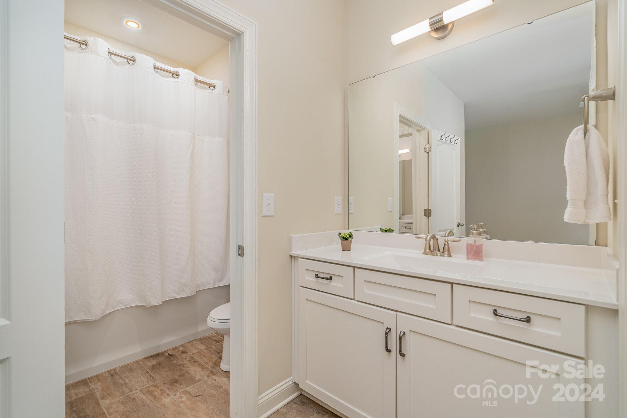 104 Smithfield Drive Charlotte, NC 28270 - Photo 32 of 39 a bathroom with a double vanity sink mirror and