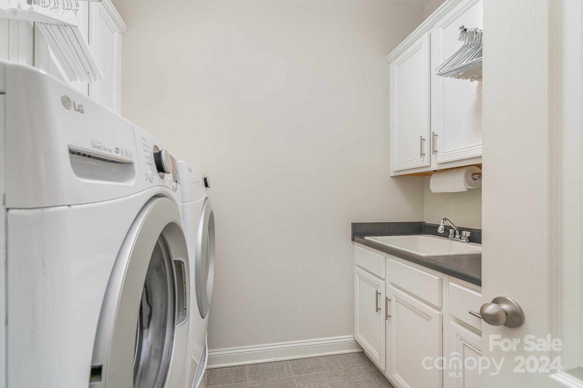 104 Smithfield Drive Charlotte, NC 28270 - Photo 34 of 39 a utility room with dryer and washer