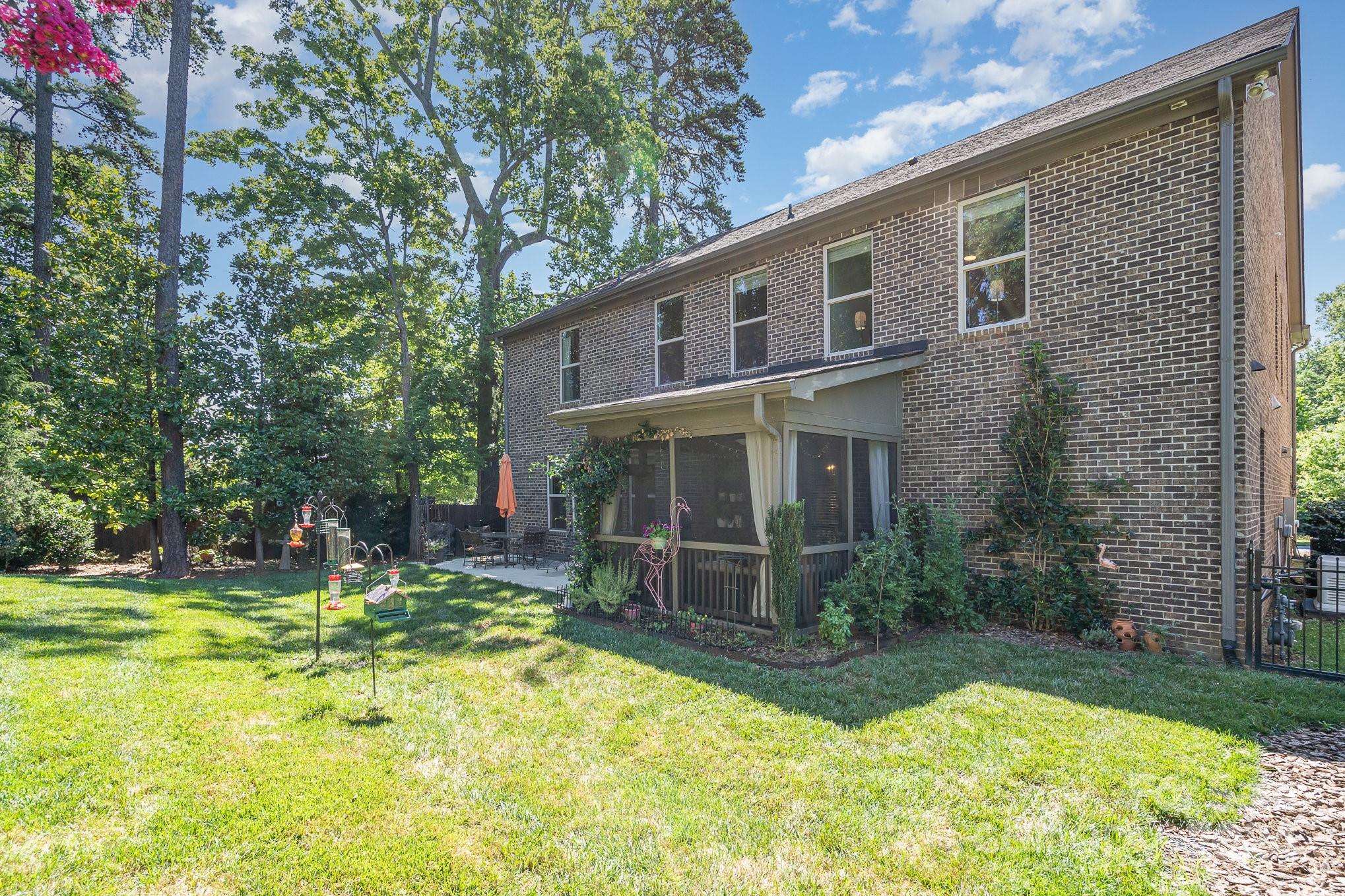 104 Smithfield Drive Charlotte, NC 28270 - Photo 38 of 39 a backyard of a house with yard and outdoor seating