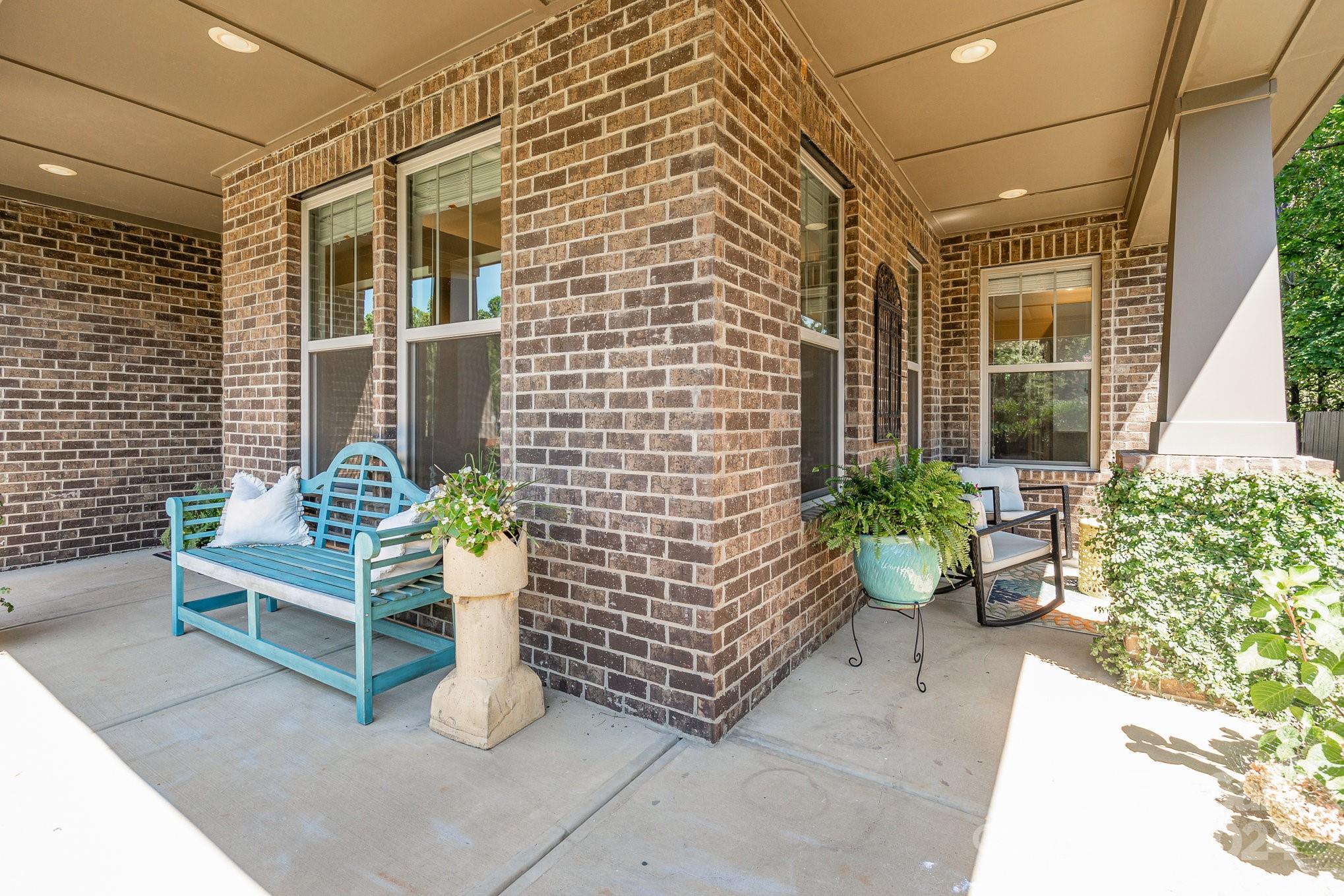 104 Smithfield Drive Charlotte, NC 28270 - Photo 4 of 39 a front view of a house with outdoor seating
