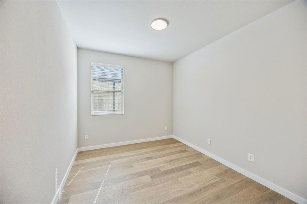 144 Millwood Road Lavon, TX 75166 - Photo 16 of 37 an empty room with a window