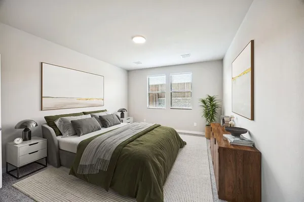 a bedroom with a bed and a couch